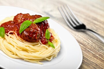 Classic Italian Pasta Spaghetti with wooden table background. Simple and easy vegetarian dish.