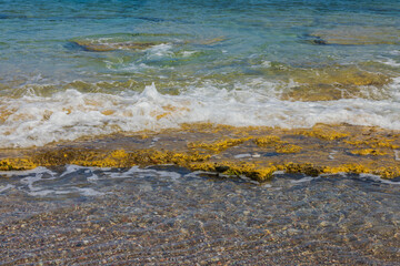 Beautiful view of foaming waves on rocky coastline. Beautiful nature backgrounds. Greece. 