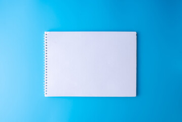 Album with a spring on a blue background