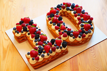 cake with berries in the form of the number ten.