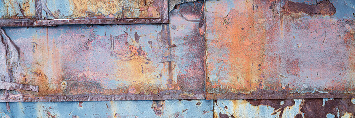Texture of rusty metal. Rough metal surface with rust. Corroded and oxidized old iron. Rusted and aged metal sheet. Wide panoramic texture for background and design in grunge style.