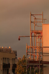 Fototapeta premium Building scaffolding, thermal insulation of the building and booths for cake