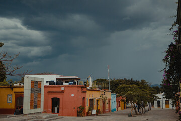Oaxaca city streets with few tourists on a rainy afternoon