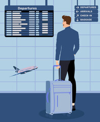 Businessman standing with luggage in the departure hall of an international airport. Man in a suit looks at the terminal timetable while waiting for a flight. Executive manager goes on a business trip