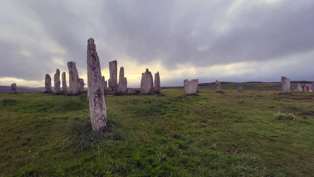 Ancient magic in the Calanais Standing Stones Circle, erected by neolithic men for worship. Celtic traditions in the outer hebrides of Scotland. Touristic attraction.
