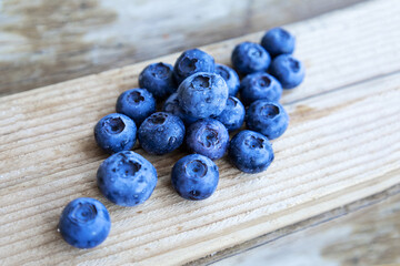 Blueberries on wooden table. Healthy food concept.
