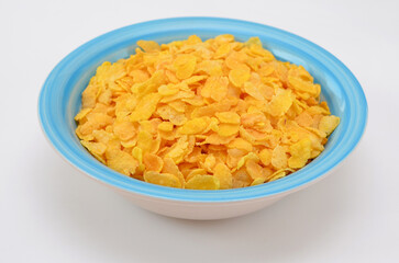 corn flakes in a bowl on a white background close-up