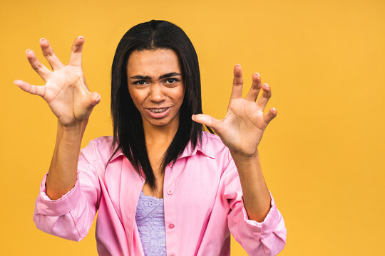 Portrait of african american black woman wearing casual depressed and worry for distress, crying angry and afraid, sad expression. Isolated over yellow background.
