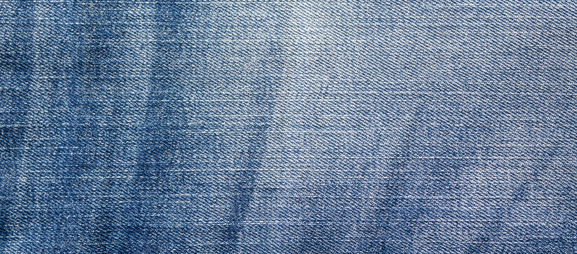 Photo of jeans fabric, denim background, texture.