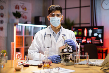 Male scientists or doctor are testing drugs to prevent and destroy new strains of the virus through...