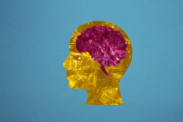 yellow water head with pink water brain, creative idea, blue background, futuristic look
