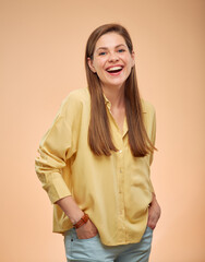 Smiling woman in yellow shirt isolated portrat on yellow background.