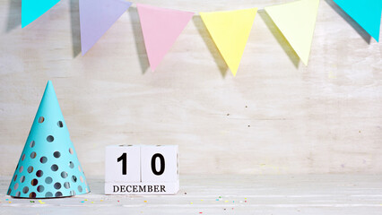 Birthday December 10 on the calendar. Happy birthday card with date copy space. Holiday decorations...