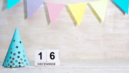 Birthday December 16 on the calendar. Happy birthday card with date copy space. Holiday decorations...
