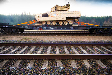 Obraz premium Pabrade/Lithuania October 21, 2019 US Army's 1st Armoured Battalion of the 9th Regiment, 1st Division from Fort Hood in Texas Bradley is unloaded as they arrive at the Pabrade railway station.