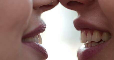 Obraz premium Closeup of Lesbian couple mouth talking to each other gossiping and in conversation