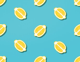 Fresh lemons. Seamless pattern. Halved ripe citrus fruits on blue backdrop