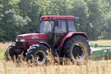 Cutting hay by tractor