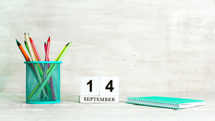 September 14 calendar. The concept of the date of the season. Pencils in a basket against the...