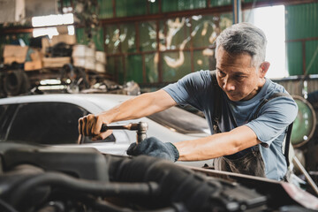 Fototapeta na wymiar mechanic working and check about auto car engine service, inspection technician having automotive job to maintenance or repair automobile in motor garage, business industrial auto car engine