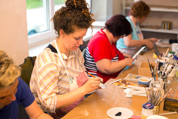Women in art workshop making decoupage boxes - obrazy, fototapety, plakaty