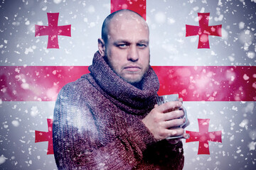 Isolate. Cold weather. Bask. A man in a fur hat and scarf warms his hands with his mouth. It's...