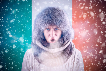 Isolate. Cold weather. Bask. A man in a fur hat and scarf warms his hands with his mouth. It's...