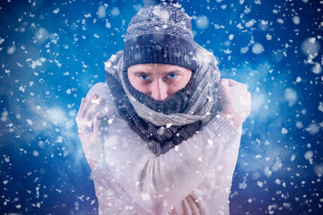 Isolate. Cold weather. Bask. A man in a fur hat and scarf warms his hands with his mouth. It's...