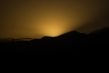 landscape in the shadows of a sunset, clear sky