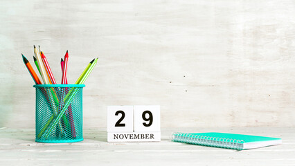 November 29 calendar. The concept of the date of the season. Pencils in a basket against the...