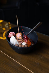 ice dessert with sweet toppings, burnt marshmallow, colored cereal, chocolate cereal, panda-shaped gummies, rice