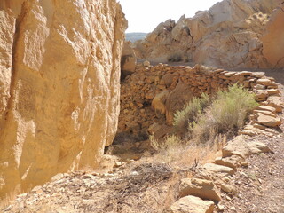 Behind rock