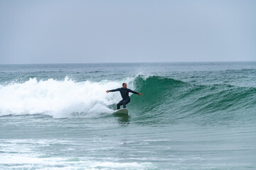 Fototapeta na wymiar Surfer riding a wave