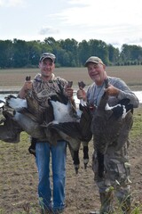 Waterfowl hunters with Canada geese 