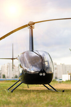 Private Stylish Black Helicopter On Helipad Waiting For The Flight In Sunny Day.  Vertical