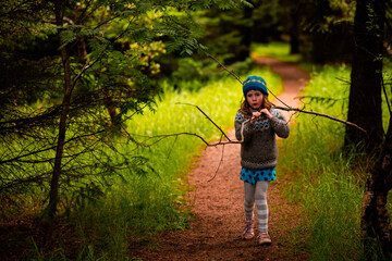 girl child playing in the forest