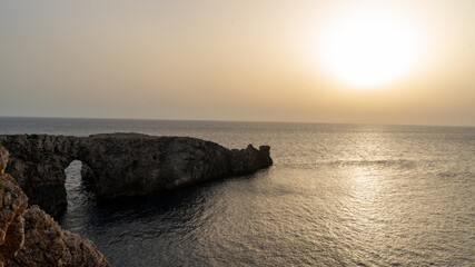 warm sunset light in Menorca - 520910256
