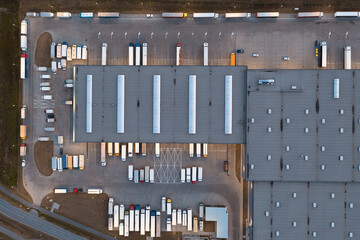 Aerial view of a warehouse with goods. Logistics center in the industrial zone of the city, many...