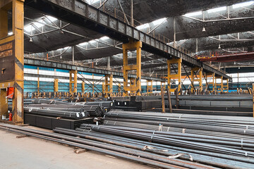 Fototapeta premium Rolled metal warehouse. large volumes of metal materials in the factory