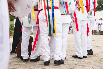  Men, women and children, members of the cultural group Chegança dos Marujos, dance and sing in...