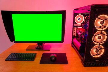 Professional workstation and gaming computer, to play video games online or do professional design and multimedia work. In a room with colorful neon led lights.