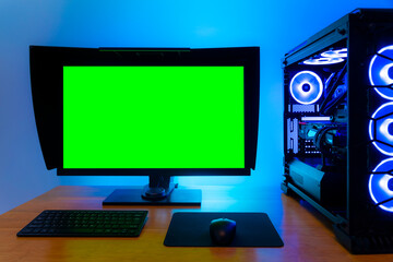 Professional workstation and gaming computer, to play video games online or do professional design and multimedia work. In a room with colorful neon led lights.