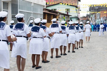  Men, women and children, members of the cultural group Chegança dos Marujos, dance and sing in...