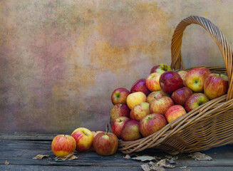 basket full of ripe apples in autumn