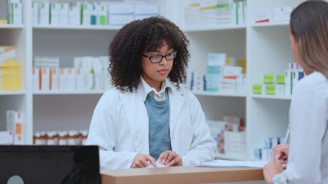 Medical Professional Helping Patient At Counter To Buy Medicine At Drug Store. Customer Writing Their Personal Data For Medication At The Pharmacy Store From Doctor To Get Prescription Healthcare.