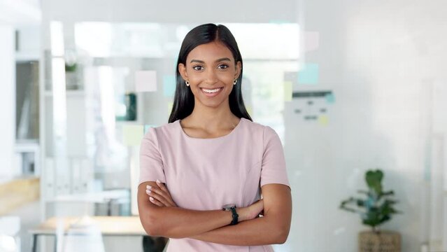 Confident manager, leader and creative boss with her arms crossed in a powerful, assertive and proud stance. Portrait of smiling, happy and female marketing agent ready for success with arms folded