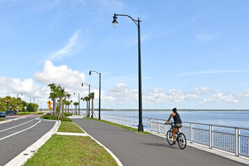 Biking along the waterfront of Lake Monroe in Sanford, Florida. 
