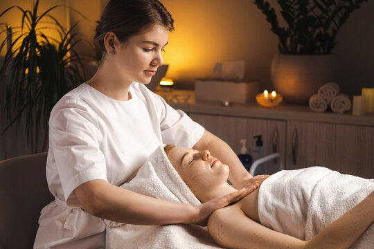 Caucasian woman receiving shoulders massage in beauty spa salon. Skin care. Body care. Skin treatment.