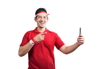 Indonesian men celebrate Indonesian independence day on 17 August while holding mobile phones