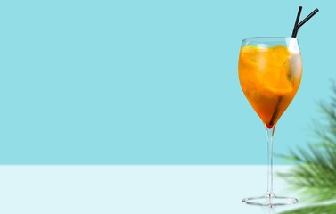 Cold drink with red orange and ice in glass. Refreshing lemonade, summer drink, cocktail, soda.